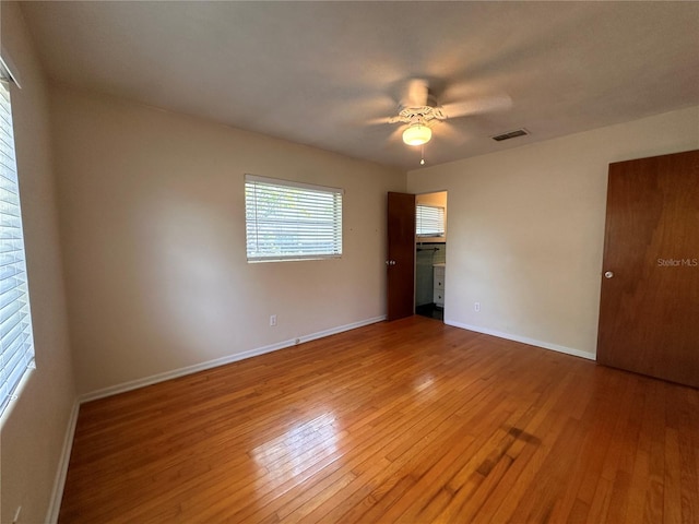 unfurnished room featuring ceiling fan and light hardwood / wood-style floors