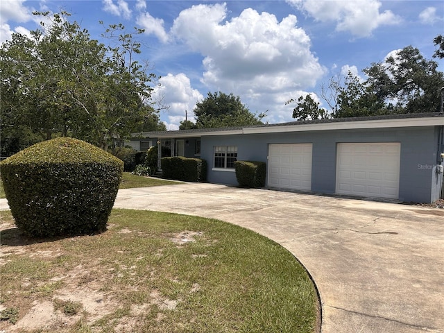 single story home with a garage