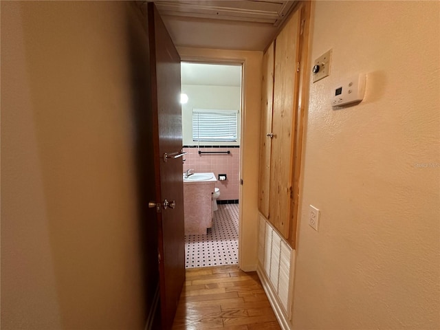 hallway featuring wood-type flooring