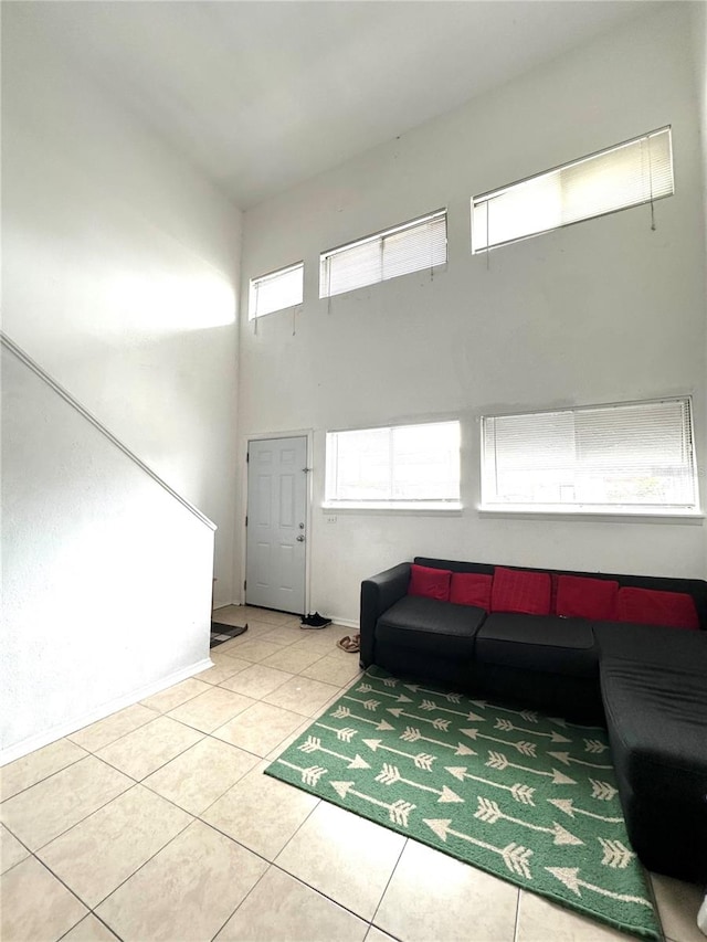 tiled living room featuring a healthy amount of sunlight