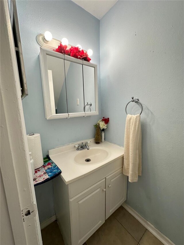 bathroom featuring vanity and tile patterned flooring