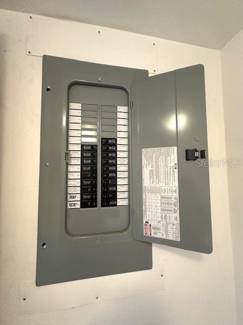 utility room featuring electric panel