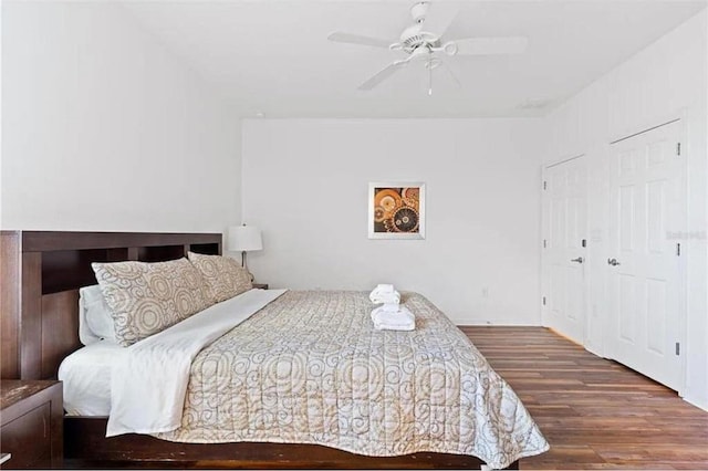 bedroom featuring a ceiling fan and wood finished floors