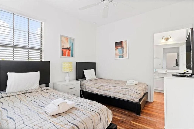 bedroom with light wood-style flooring and ceiling fan