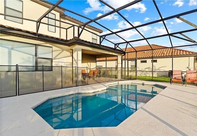 view of swimming pool with a lanai, a fenced in pool, and a patio