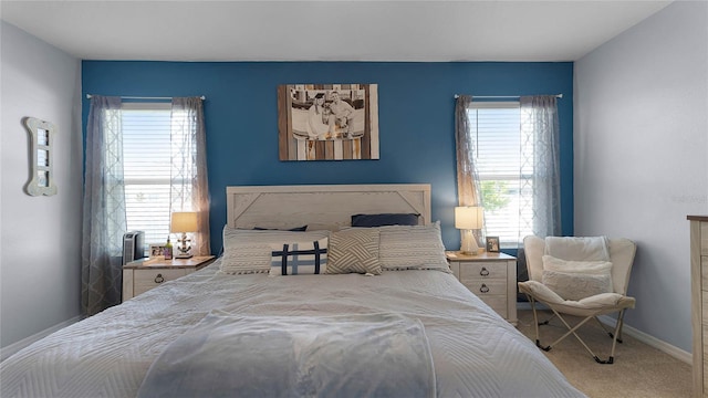 carpeted bedroom with multiple windows