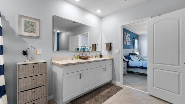 bathroom with tile patterned flooring and vanity