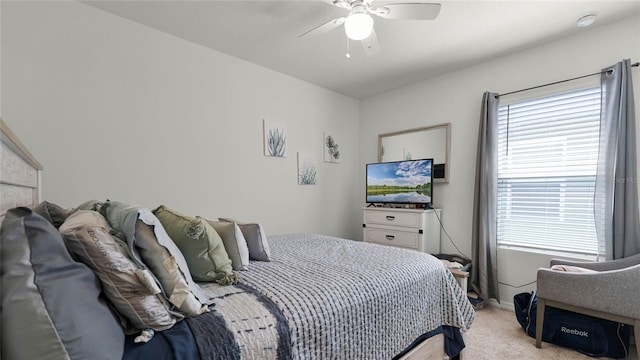 bedroom featuring light carpet and ceiling fan