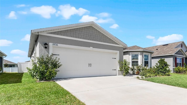 view of front facade featuring a front yard and a garage