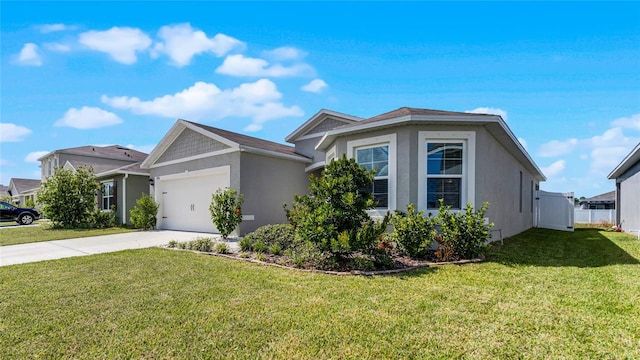 view of front of home with a garage and a front lawn