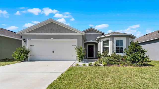 view of front facade with a front yard and a garage