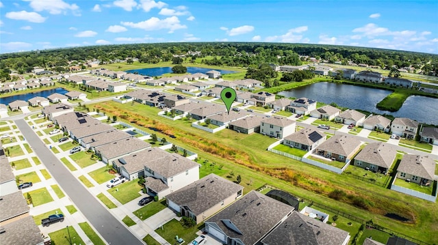 drone / aerial view with a water view