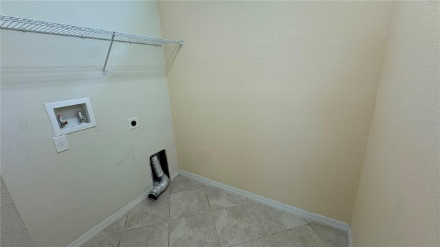 laundry area with hookup for a washing machine, electric dryer hookup, and light tile patterned flooring