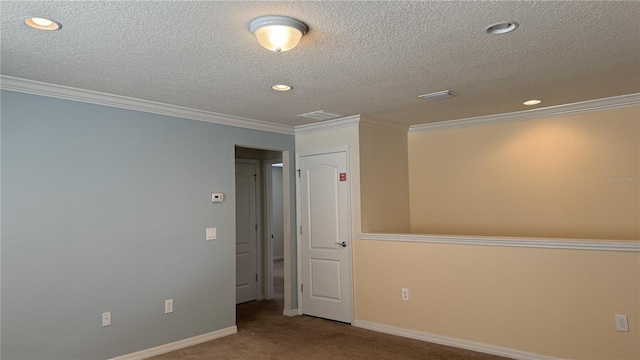 unfurnished room featuring a textured ceiling, carpet flooring, and crown molding