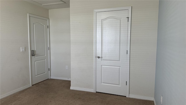 unfurnished bedroom featuring light carpet