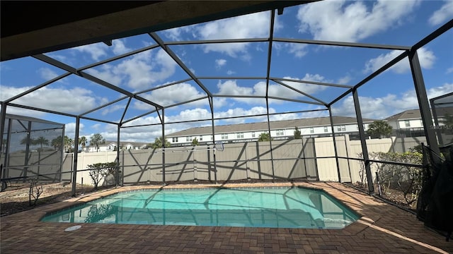 view of pool with a lanai and a patio area