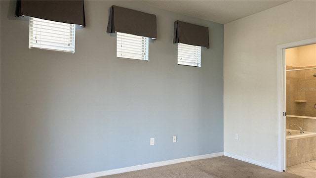 spare room with light colored carpet