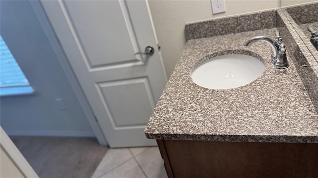 bathroom with vanity and tile patterned floors