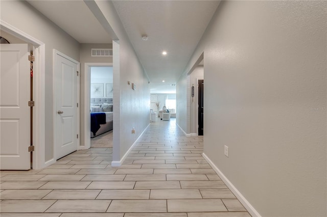 corridor featuring light hardwood / wood-style floors