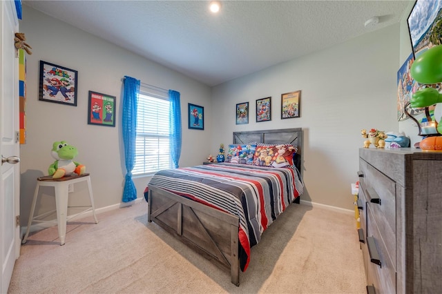 carpeted bedroom featuring a textured ceiling