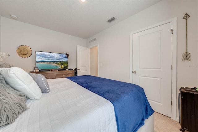 bedroom with light carpet