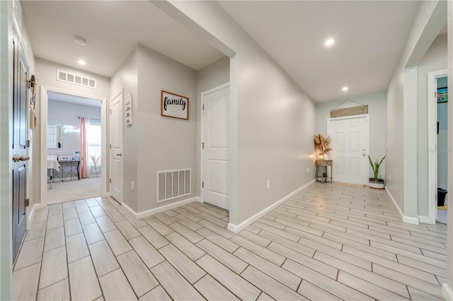 hallway with light wood-type flooring