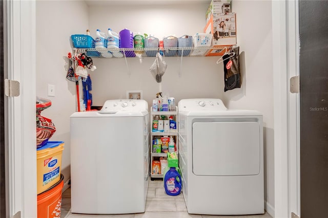 washroom with washing machine and dryer