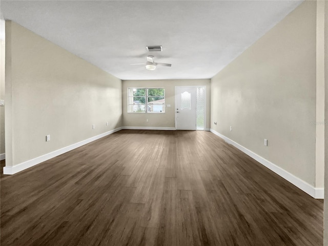 spare room featuring ceiling fan and dark hardwood / wood-style flooring