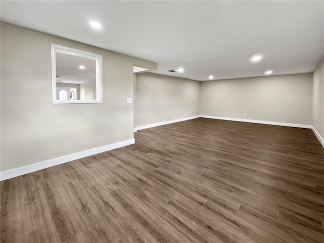 spare room with wood-type flooring