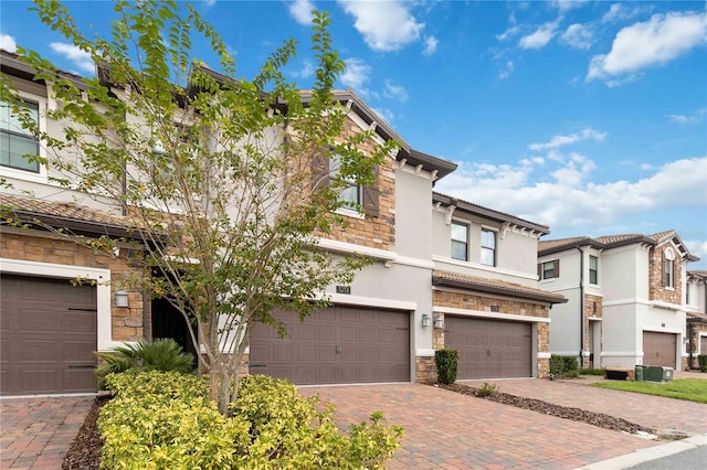 multi unit property featuring a garage