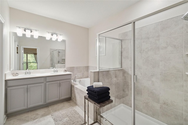 bathroom featuring vanity, separate shower and tub, and tile patterned floors