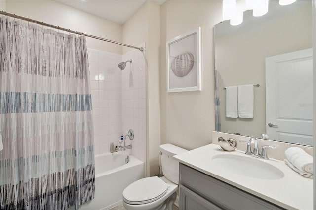 full bathroom featuring shower / bath combo, vanity, and toilet