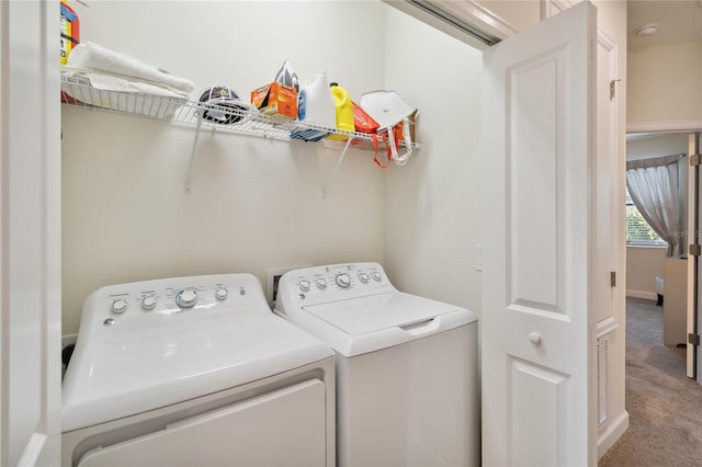 washroom with carpet flooring and washer and dryer