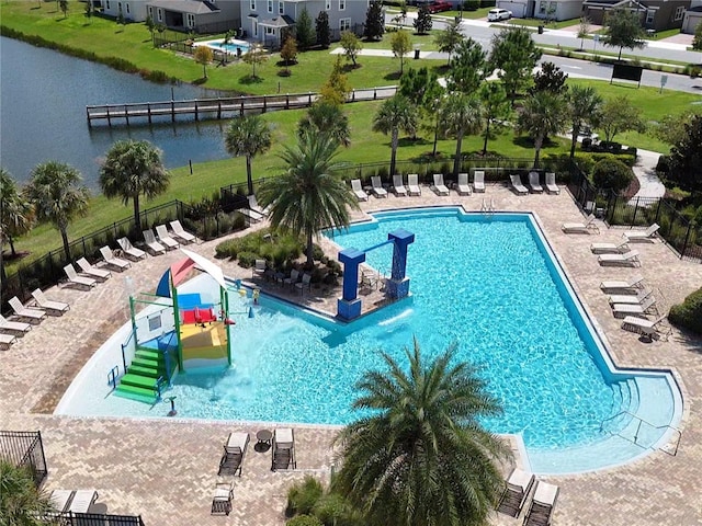 view of swimming pool featuring a water view