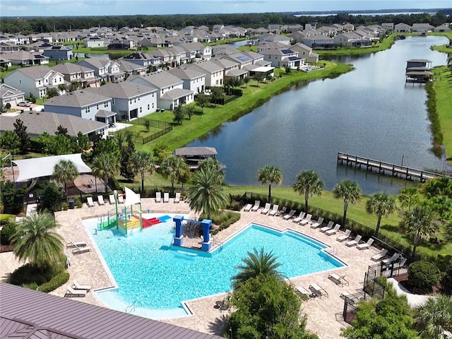 view of swimming pool featuring a water view