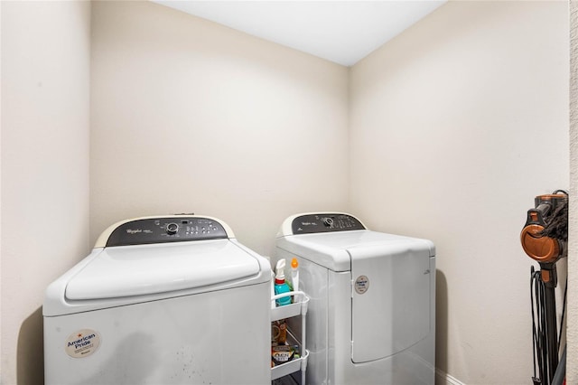 clothes washing area featuring washing machine and dryer