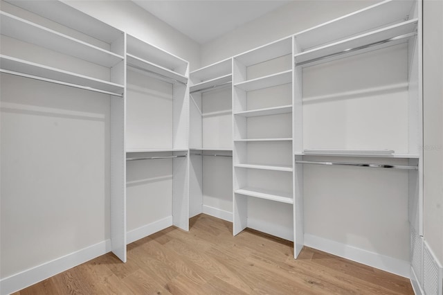 walk in closet featuring wood-type flooring