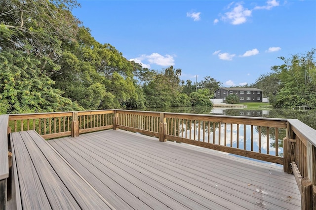 wooden deck featuring a water view