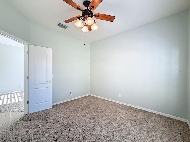 empty room featuring ceiling fan and carpet floors