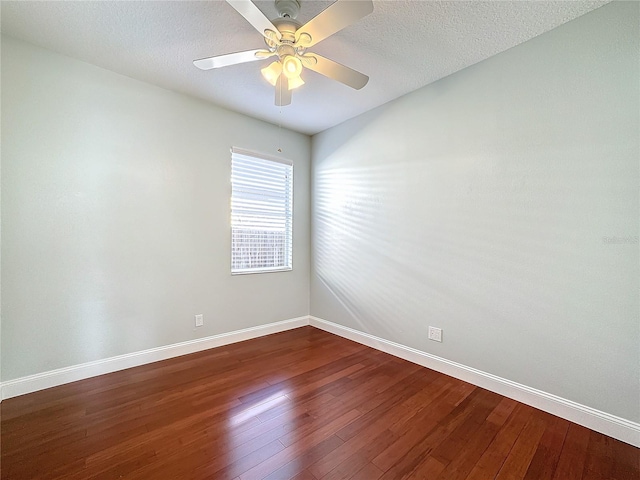 unfurnished room featuring ceiling fan, dark hardwood / wood-style flooring, and a textured ceiling