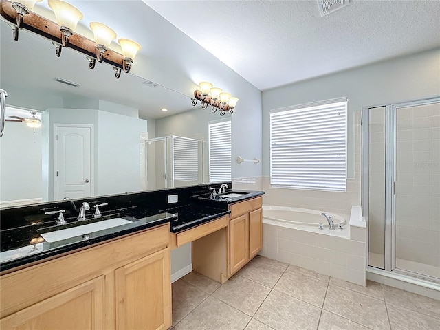 bathroom featuring separate shower and tub, tile patterned floors, vanity, a textured ceiling, and ceiling fan