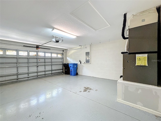 garage featuring a garage door opener, electric panel, and heating unit