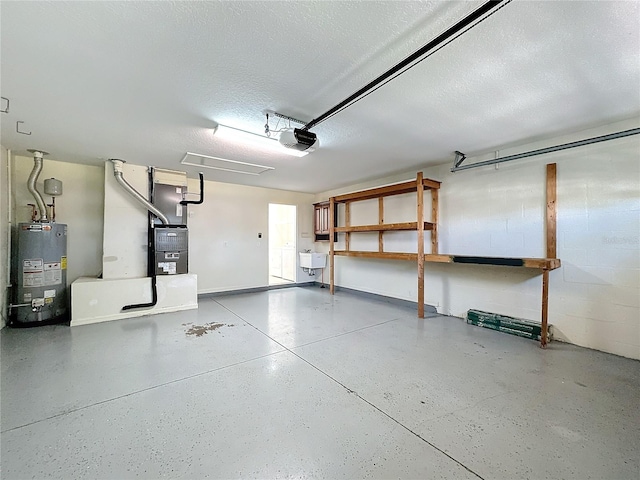 garage featuring heating unit, sink, a garage door opener, and water heater