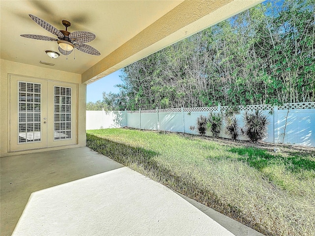 view of yard featuring ceiling fan and a patio area