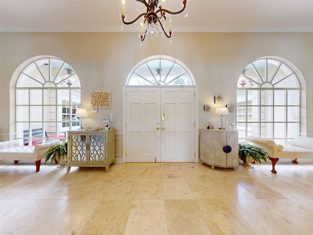 entrance foyer with a notable chandelier