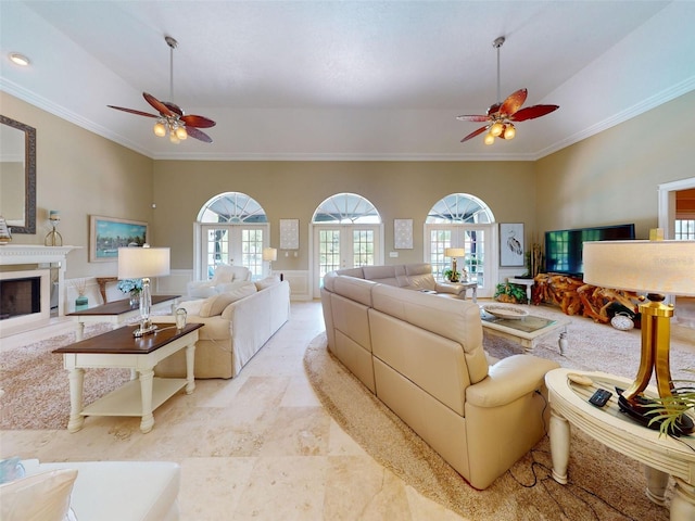 living room with french doors, ceiling fan, lofted ceiling, and crown molding