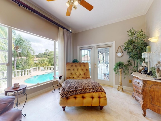 living area featuring ornamental molding, french doors, and ceiling fan