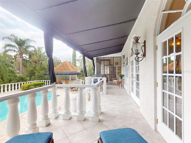 view of pool featuring french doors