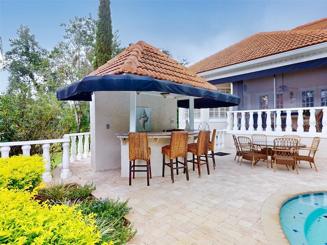 view of patio / terrace with an outdoor bar