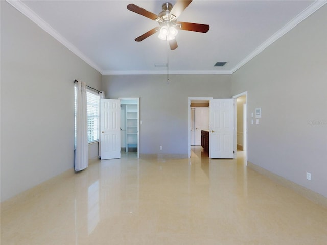 spare room with ornamental molding and ceiling fan